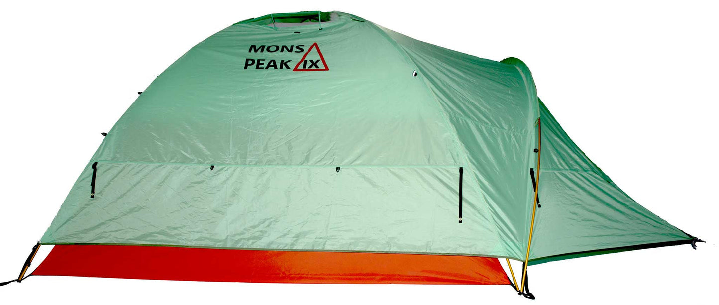 Mons Peak IX green dome camping tent fully pitched with lime-green rainfly featuring Mons Peak IX logo, orange bathtub floor, yellow fiberglass poles, black guy lines, and extended vestibule