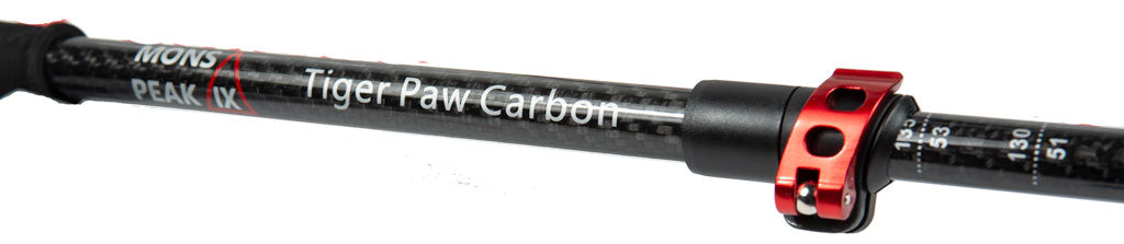 Close-up of Mons Peak IX Tiger Paw 7075 carbon fiber trekking pole shaft with red aluminum locking collar and height adjustment markings