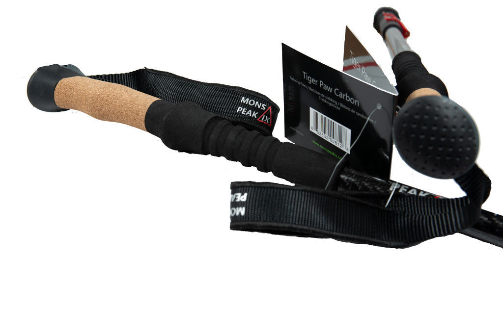 Mons Peak IX Tiger Paw Carbon trekking poles with cork grips, adjustable black straps, rubber tips, and packaging tags
